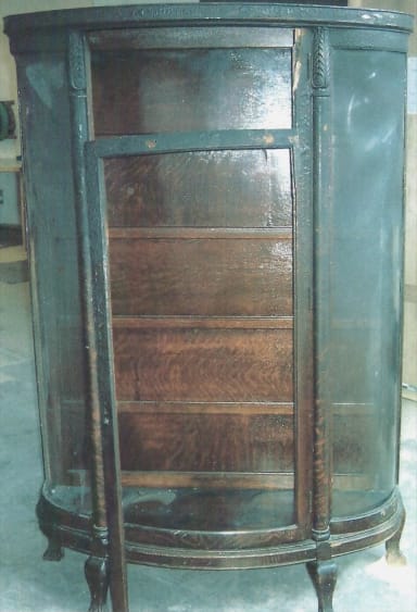 dark brown damaged, chipped cabinet